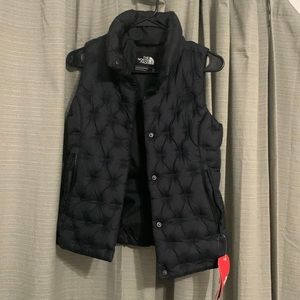 Perfect brand new with tags North Face puff vest, black, XS.